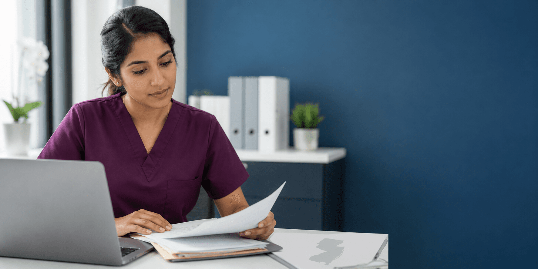 Healthcare professional reviewing New Jersey licensure documents